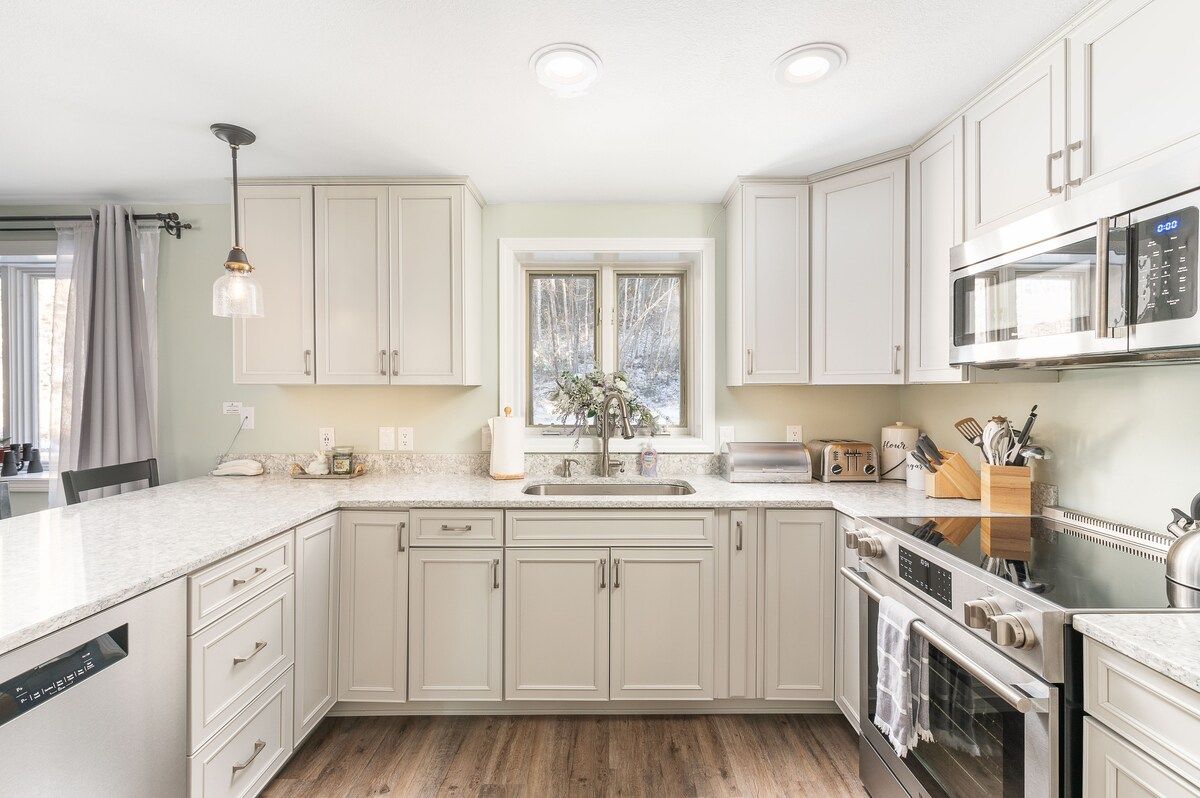 Modern kitchen with stainless steel appliances and white cabinets